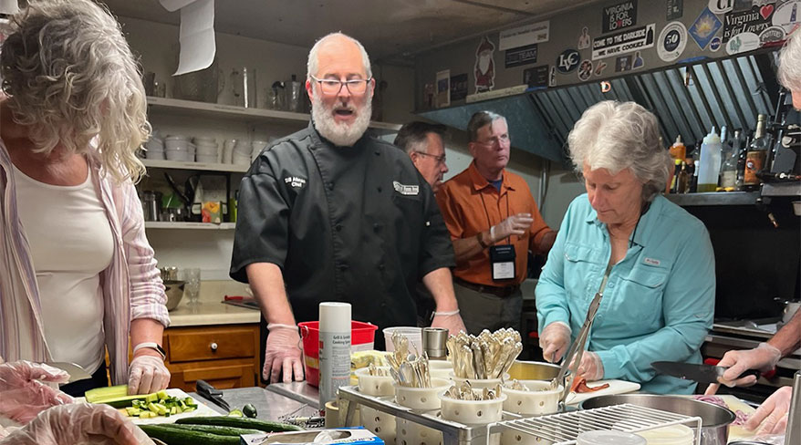 A chef instructs participants during a sea-to-table cooking class on Chincoteague Island, Virginia.