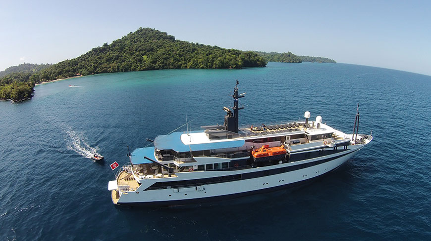 The Variety Voyager ship sails on the turquoise water near a green island in Greece/Turkey.