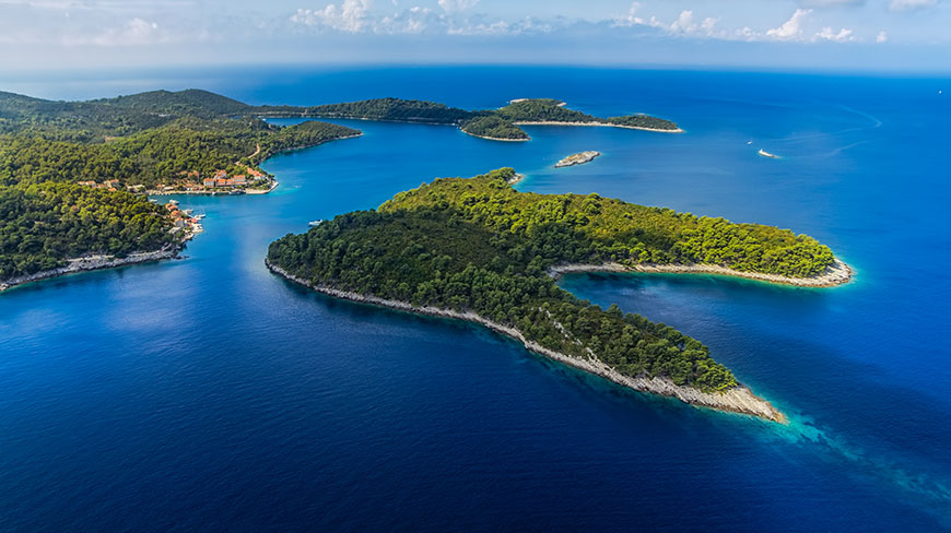 Aerial view of the lush green islands of Mljet National Park surrounded by the deep blue Adriatic Sea in Croatia.